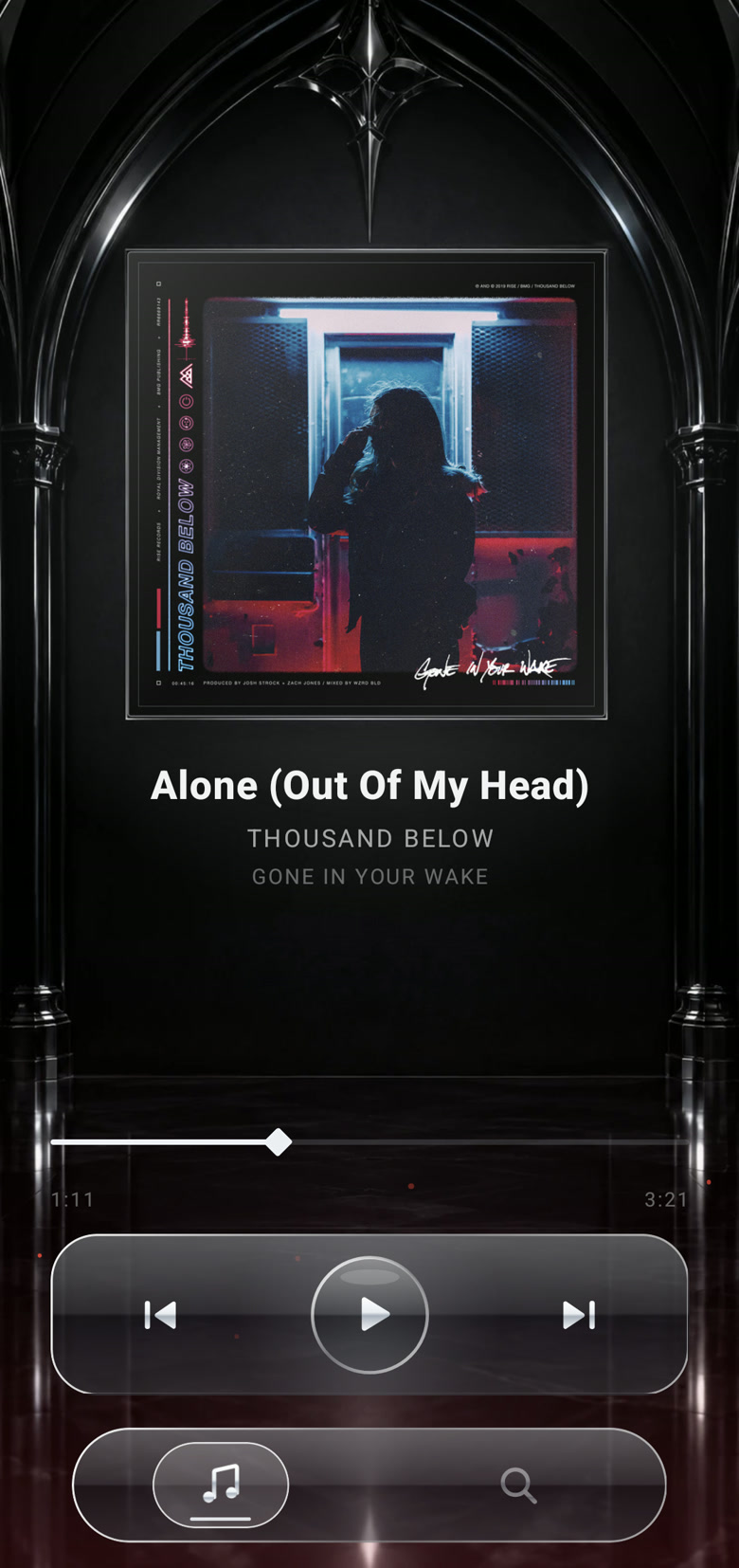 Music Player now-playing screen: album art in a silver frame, the seek bar and glass playback controls.